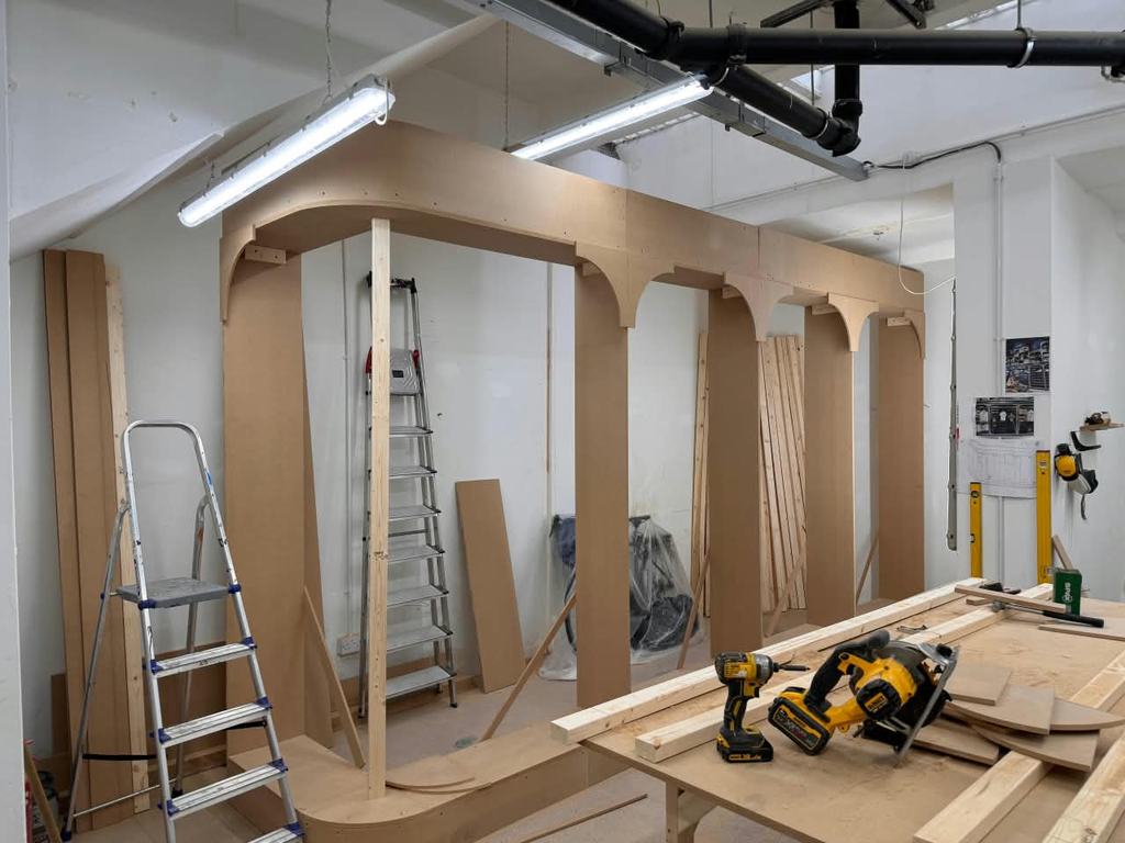 The same arcade cut and dry-assembled in the Northstead workshop before painting.